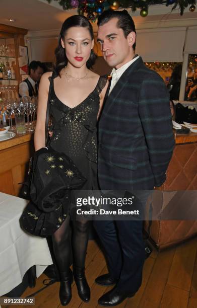 Martine Lervik and James Kelly attend the Love x Chaos x Poppy Delevingne x Moet Christmas Party at George on December 12, 2017 in London, England.