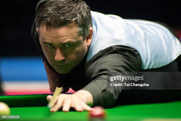 Alan McManus of Scotland plays a shot during his first round match against Matthew Selt of England on day two of the 2017 Scottish Open at Emirates...