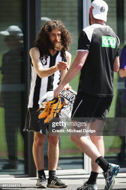 Keen fan gets an autograph during a Collingwood Magpies AFL training session on December 13, 2017 in Melbourne, Australia.