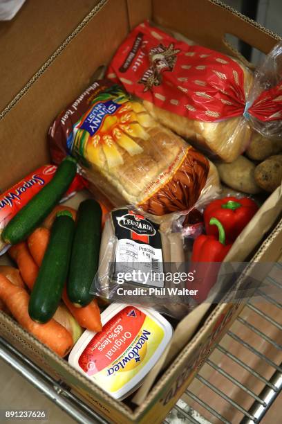 Auckland City Mission volunteers prepare food parcels for families in need over Christmas on December 13, 2017 in Auckland, New Zealand. Hundreds of...