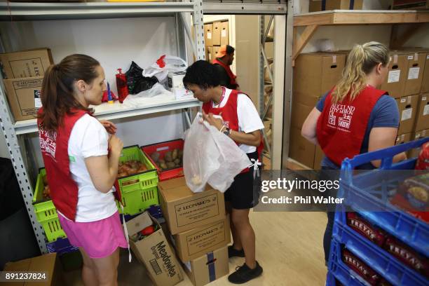 Auckland City Mission volunteers prepare food parcels for families in need over Christmas on December 13, 2017 in Auckland, New Zealand. Hundreds of...
