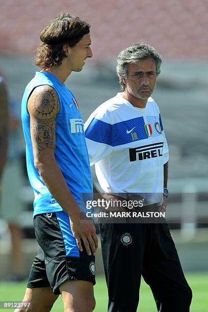 Inter Milan forward Zlatan Ibrahimovic talks with coach José Mourinho as they train at the Rose Bowl on the eve of their game against Chelsea, in Los...