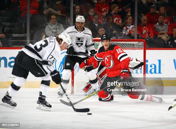 Steven Santini of the New Jersey Devils drops to the ice to block a second period shot from Tyler Toffoli of the Los Angeles Kings at the Prudential...