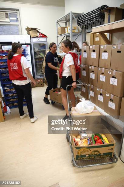 Auckland City Mission volunteers prepare food parcels for families in need over Christmas on December 13, 2017 in Auckland, New Zealand. Hundreds of...