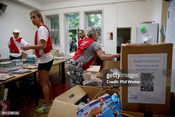 Auckland City Mission volunteers prepare Christmas presents for families in need over Christmas on December 13, 2017 in Auckland, New Zealand....