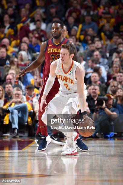 Luke Babbitt of the Atlanta Hawks handles the ball against the Cleveland Cavaliers on December 12, 2017 at Quicken Loans Arena in Cleveland, Ohio....