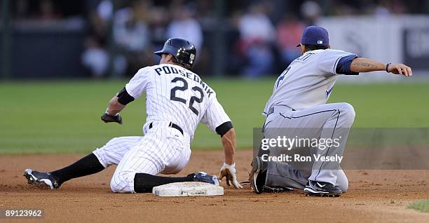 Scott Podsednik of the Chicago White Sox steals second base as the ball gets by Jason Bartlett of the Tampa Bay Rays on July 20, 2009 at U.S....