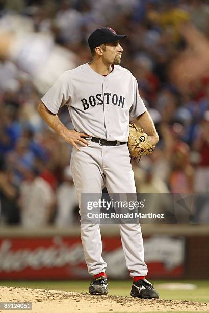 Pitcher John Smoltz of the Boston Red Sox reacts after giving up a two-run home run to David Murphy of the Texas Rangers in the sixth inning during...