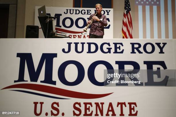 Performer plays music during an election night party for Roy Moore, Republican candidate for U.S. Senate from Alabama, in Montgomery, Alabama, U.S.,...