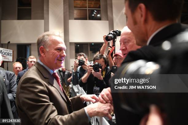 Republican senatorial candidate Roy Moore greets supporters at an election night party in Montgomery, Alabama, on December 12, 2017. Alabama voters...