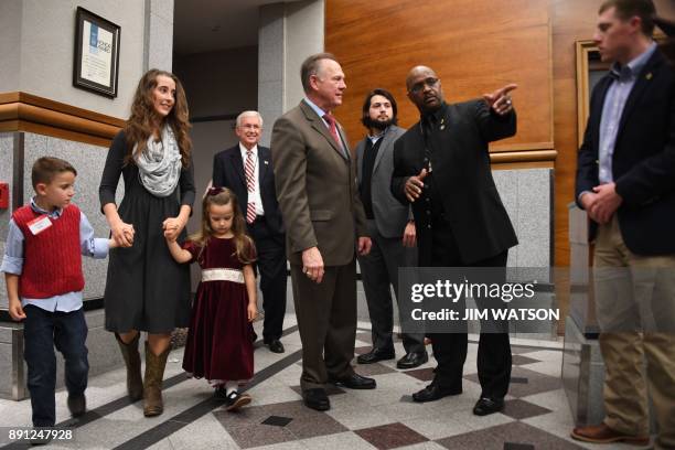 Republican senatorial candidate Roy Moore arrives at an election night party in Montgomery, Alabama, on December 12, 2017. Alabama voters were...