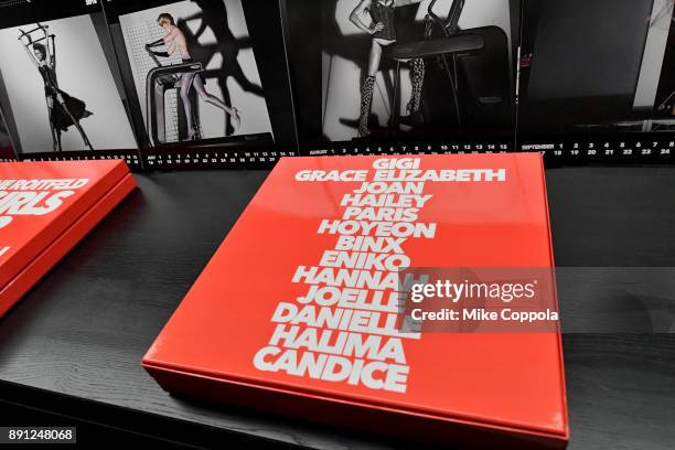 View of the calendars on display at the CR Fashion Book Celebrating launch of CR Girls 2018 with Technogym at Spring Place on December 12, 2017 in...