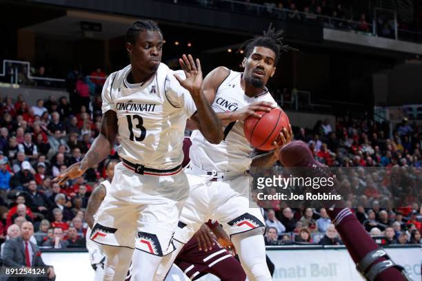 Jacob Evans and Tre Scott of the Cincinnati Bearcats rebound in the second half of a game against the Mississippi State Bulldogs at BB&T Arena on...