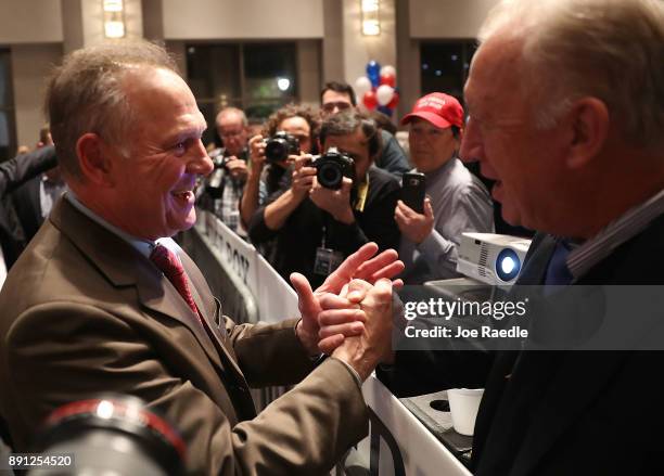 Republican Senatorial candidate Roy Moore arrives for his election night party in the RSA Activity Center on December 12, 2017 in Montgomery,...