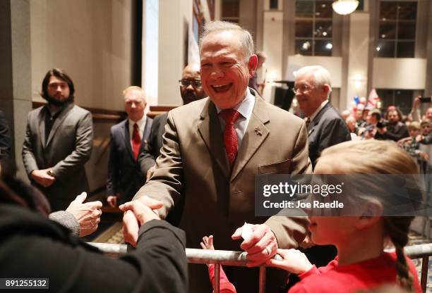 Republican Senatorial candidate Roy Moore arrives for his election night party in the RSA Activity Center on December 12, 2017 in Montgomery,...