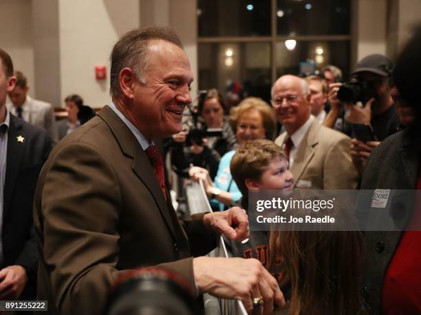 Republican Senatorial candidate Roy Moore arrives for his election night party in the RSA Activity Center on December 12, 2017 in Montgomery,...
