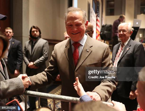 Republican Senatorial candidate Roy Moore arrives for his election night party in the RSA Activity Center on December 12, 2017 in Montgomery,...