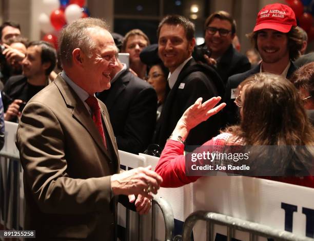 Republican Senatorial candidate Roy Moore arrives for his election night party in the RSA Activity Center on December 12, 2017 in Montgomery,...