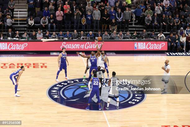 Tip off between Joel Embiid of the Philadelphia 76ers and Karl-Anthony Towns of the Minnesota Timberwolves on December 12, 2017 at Target Center in...