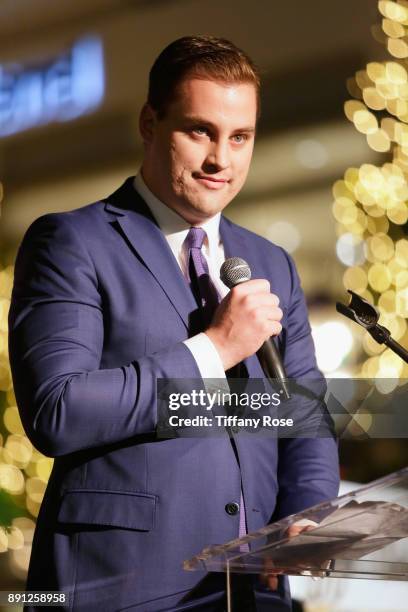 Ryan Hawley speaks onstage at the Village Synagogue and Emmanuelle Chriqui Host Menorah Lighting Ceremony at The Grove on December 12, 2017 in Los...