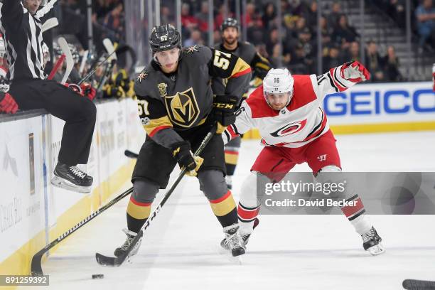 David Perron of the Vegas Golden Knights skates with the puck while Marcus Kruger of the Carolina Hurricanes defends during the game at T-Mobile...