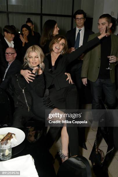 Fergie and Carine Roitfeld attend the CR Fashion Book Celebrating launch of CR Girls 2018 with Technogym at Spring Place on December 12, 2017 in New...