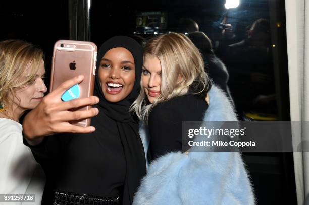 Halima Aden and Fergie attend the CR Fashion Book Celebrating launch of CR Girls 2018 with Technogym at Spring Place on December 12, 2017 in New York...