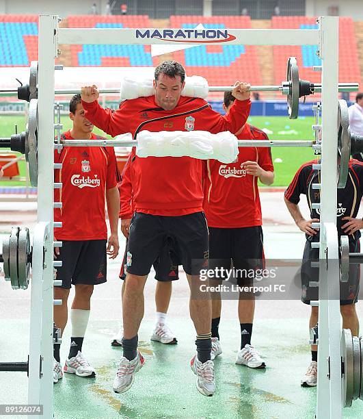 Jamie Carragher holds up weights during a Liverpool training session on July 21, 2009 in Bangkok, Thailand.