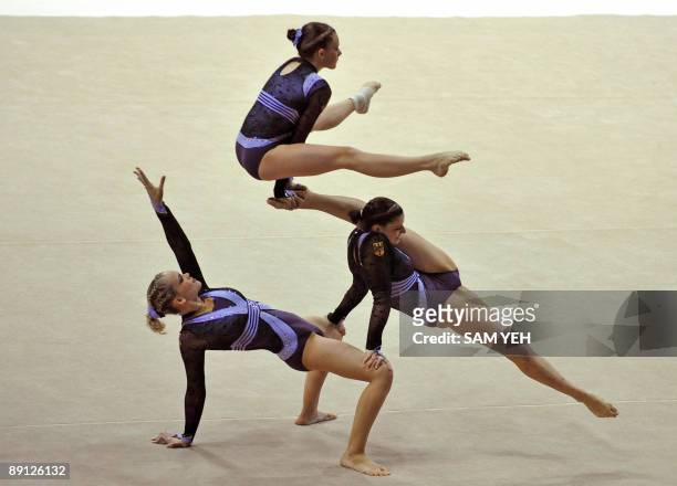 German gymnasts compete in the acrobatic gymnastics women's group competition at the World Games in Kaohsiung on July 21, 2009. The World Games drew...