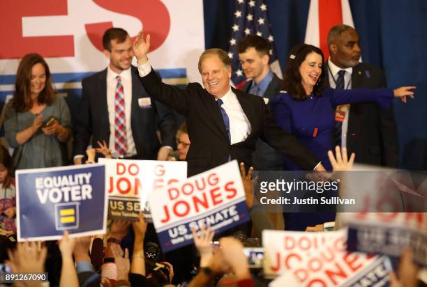 Democratic U.S. Senator elect Doug Jones greets supporters during his election night gathering the Sheraton Hotel on December 12, 2017 in Birmingham,...
