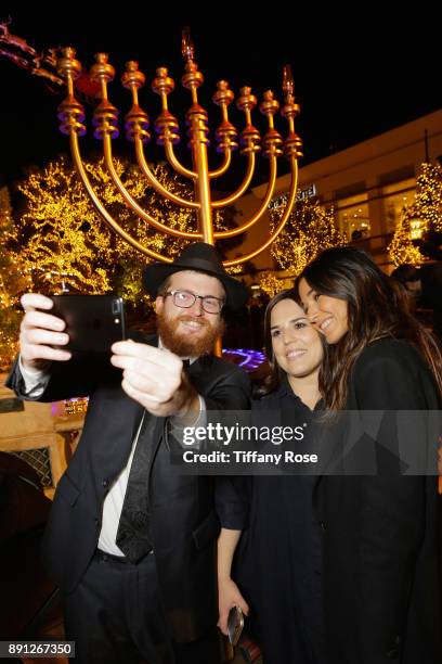 Rabbi Zamy Fogelman, Chana Fogelman and Emmanuelle Chriqui at the Village Synagogue and Emmanuelle Chriqui Host Menorah Lighting Ceremony at The...