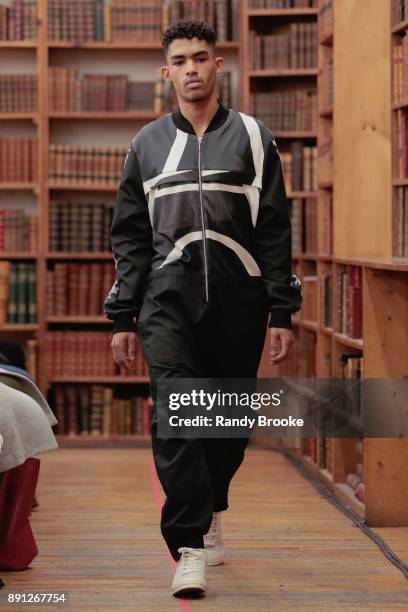 Model walks the runway during the Koche Pre-Fall 2018 Runway Show at Strand Bookstore on December 12, 2017 in New York City.