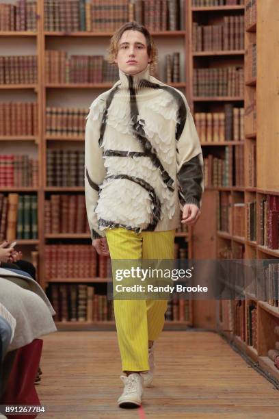 Model walks the runway during the Koche Pre-Fall 2018 Runway Show at Strand Bookstore on December 12, 2017 in New York City.