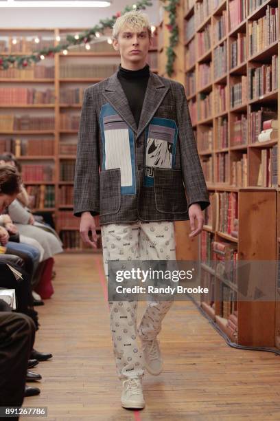 Model walks the runway during the Koche Pre-Fall 2018 Runway Show at Strand Bookstore on December 12, 2017 in New York City.