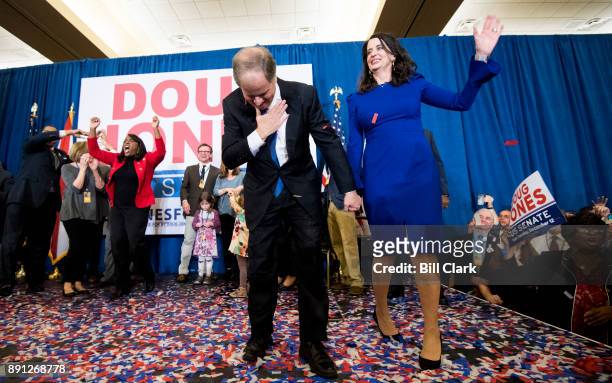 Alabama Democrat Doug Jones and his wife celebrate his victory over Judge Roy Moore at the Sheraton in Birmingham, Ala., on Tuesday, Dec. 12, 2017....