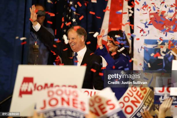 Democratic U.S. Senator elect Doug Jones and wife Louise Jones greet supporters during his election night gathering the Sheraton Hotel on December...