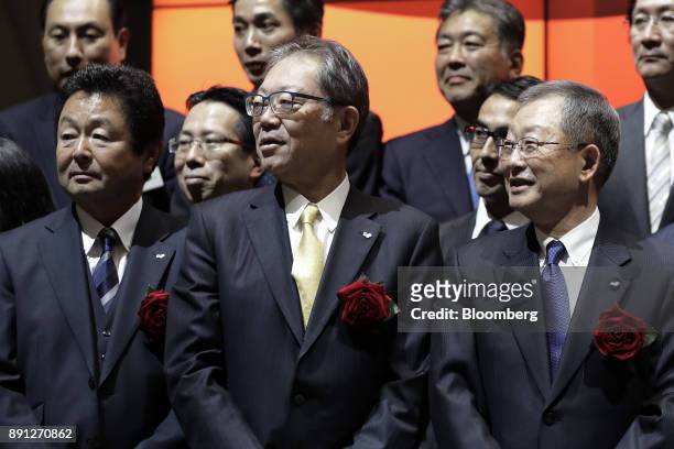 Hideo Araki, president and chief executive officer of Sagawa Express Co., front row left, Tadashi Machida, president and chief operating officer of...