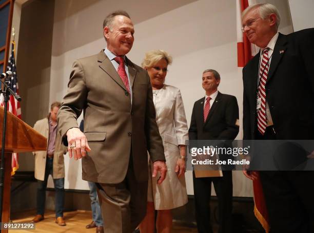 Republican Senatorial candidate Roy Moore walks with his wife Kayla Moore after saying the race against his Democratic opponent Doug Jones is too...