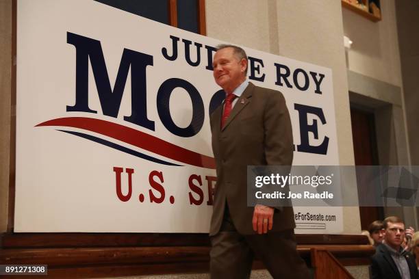 Republican Senatorial candidate Roy Moore arrives on stage to speak about the race against his Democratic opponent Doug Jones is too close and there...