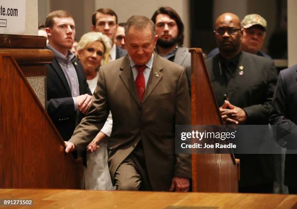 Republican Senatorial candidate Roy Moore waits to be introduced to speak about the race against his Democratic opponent Doug Jones is too close and...