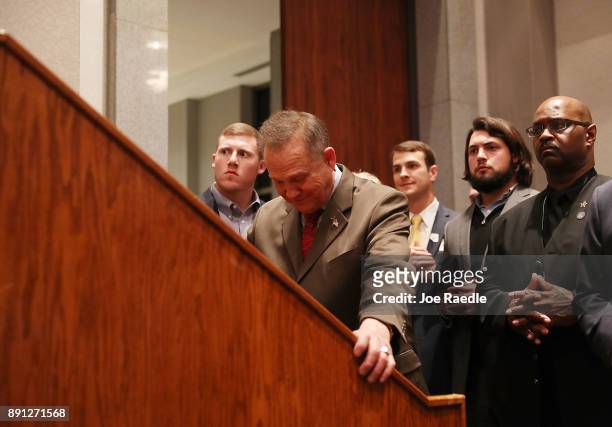 Republican Senatorial candidate Roy Moore waits to be introduced to speak about the race against his Democratic opponent Doug Jones is too close and...