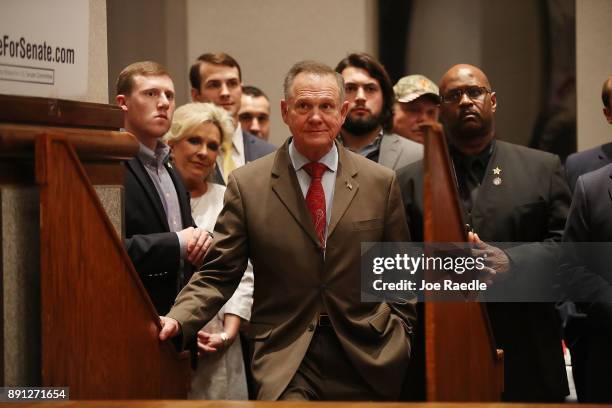 Republican Senatorial candidate Roy Moore waits to be introduced to speak about the race against his Democratic opponent Doug Jones is too close and...