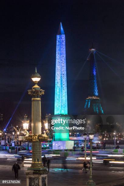 The Obelisk of the concorde's place was lit by the color of the One Planet Summit of Paris, France, on 12 December 2017.