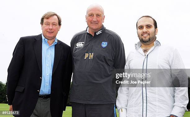 Portsmouth FC's new chairman Sulaiman Al Fahim poses for photographs with manager Paul Hart and CEO Peter Storrie during a visit to the club's...