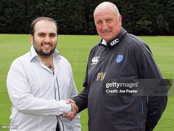 Portsmouth FC's new chairman Sulaiman Al Fahim shakes hands with the manager Paul Hart during a visit to the club's training ground on July 21, 2009...