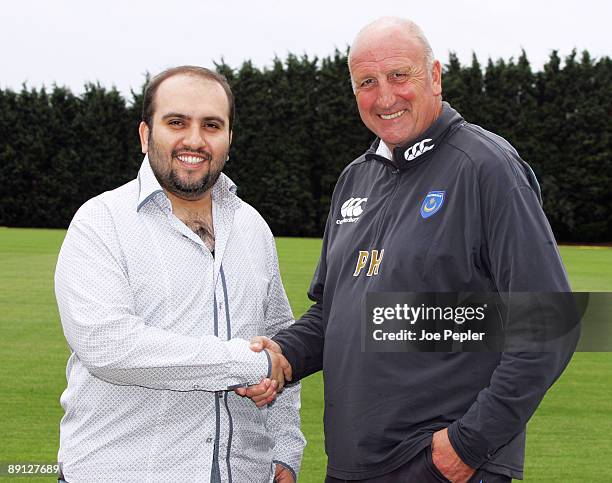 Portsmouth FC's new chairman Sulaiman Al Fahim shakes hands with the manager Paul Hart during a visit to the club's training ground on July 21, 2009...