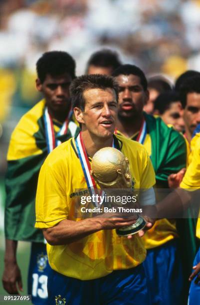 Team captain Dunga holding the FIFA World Cup Trophy after Brazil beat Italy 3-2 on penalties in the final of the World Cup, at the Rose Bowl,...