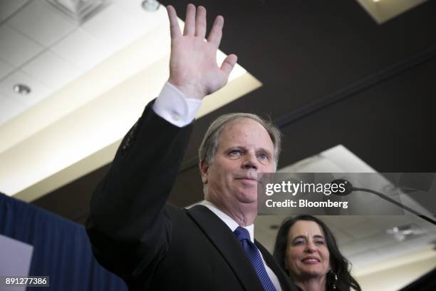 Senator-elect Doug Jones, a Democrat from Alabama, center, and wife Louise Jones greet the audience at an election night party in Birmingham,...