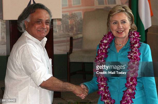 Secretary of State Hillary Rodham Clinton is welcomed by Jairam Ramesh, Indian Minister of state for Environment and Forests, as she arrives to...