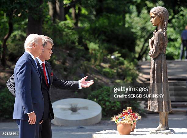 Vice President Joe Biden and Ukraine's President Viktor Yushchenko lay wreathes near a sculpture on Golodomor memorial in Kiev on July 21, 2009....